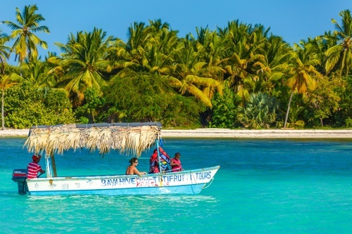 Tourist boat and paradise beach
