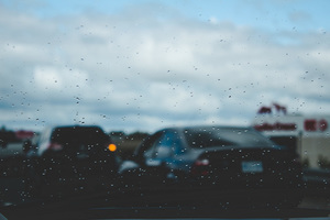 Cars through rainy windshield