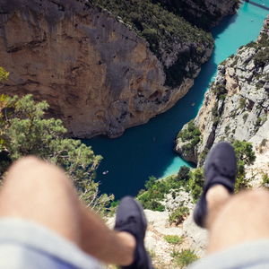Man's legs high above the water