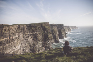 Man watching the Cliffs of Moher