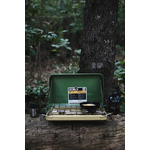 Portable stove on wooden log