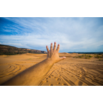 Male hand spread towards sand