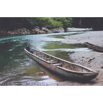 Old canoe on a river beach