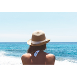 Girl with hat on the beach