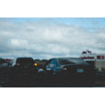 Cars through rainy windshield