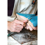 Carving wooden shoes